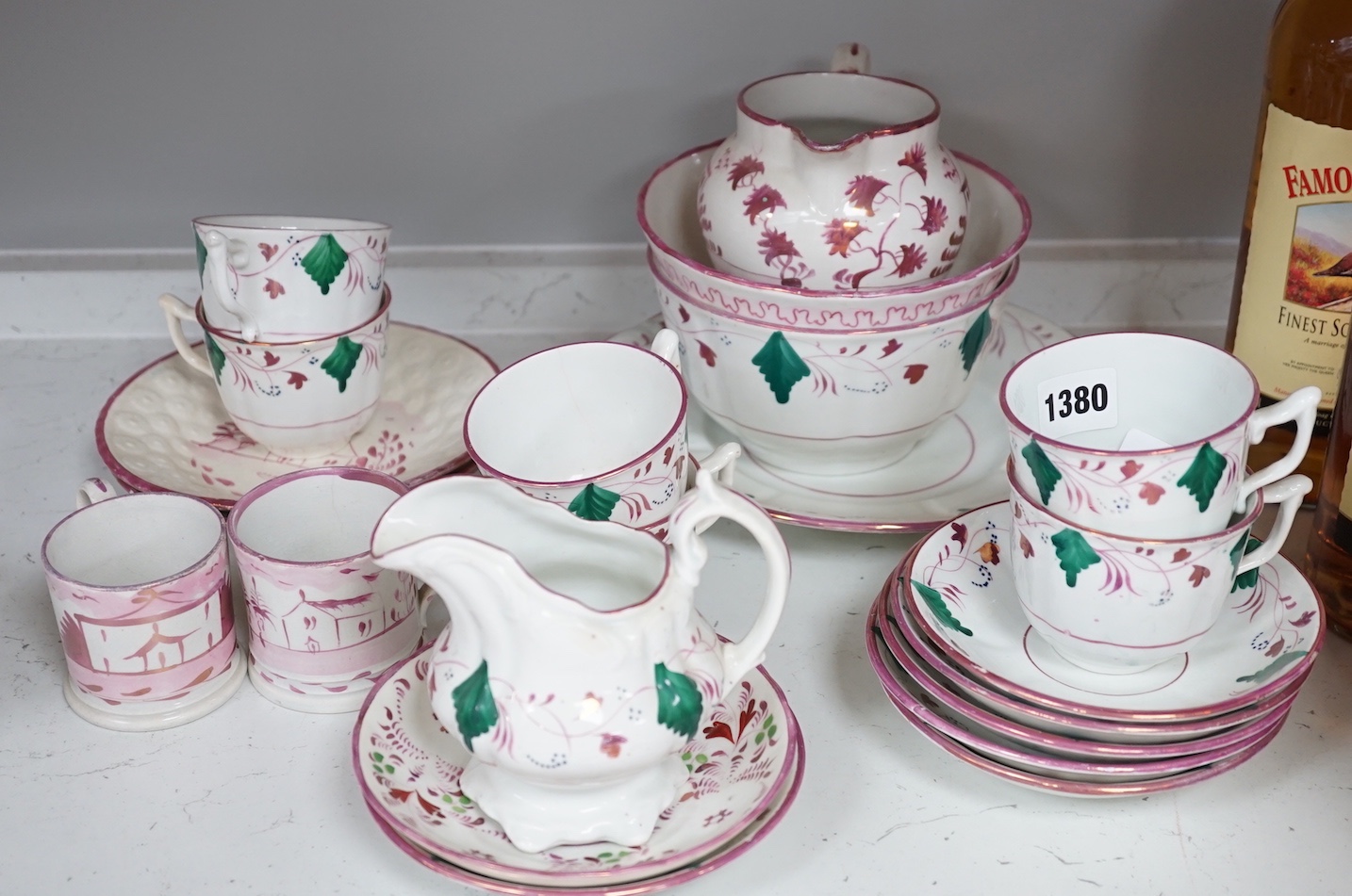 A collection of Welsh or English pink lustre pottery tea wares, first half 19th century